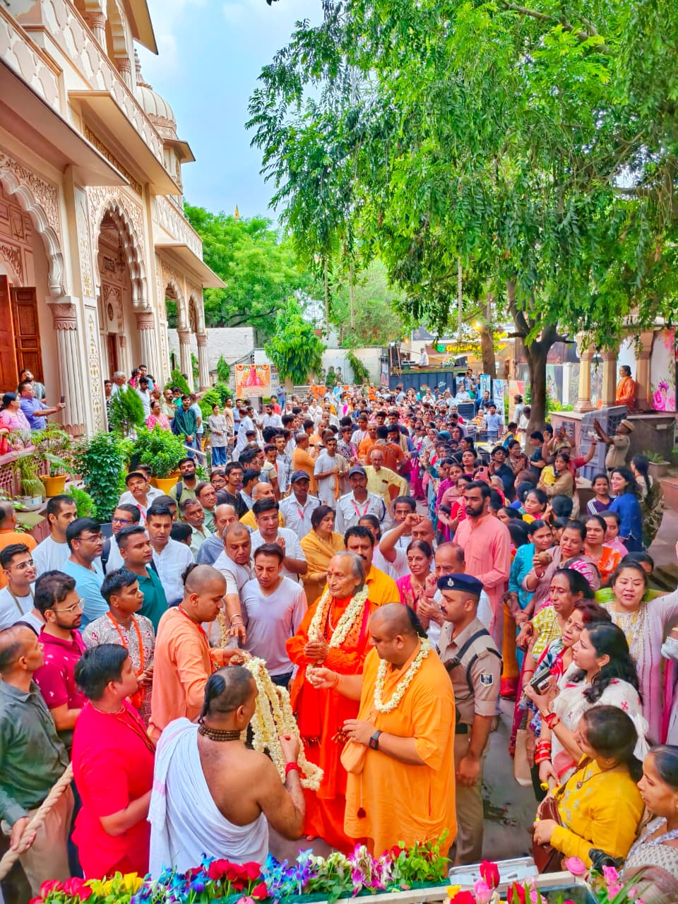 Scene of participants gathered to pull Rath at a Rath Yatra within Badshahpur Temple campus