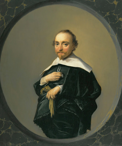 Portrait Of A Bearded Man Wearing A Black Coat With A Large White Collar Holding
