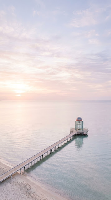 Minimalist Pier Over Calm Ocean At Sunrise - Free mobile Wallpaper