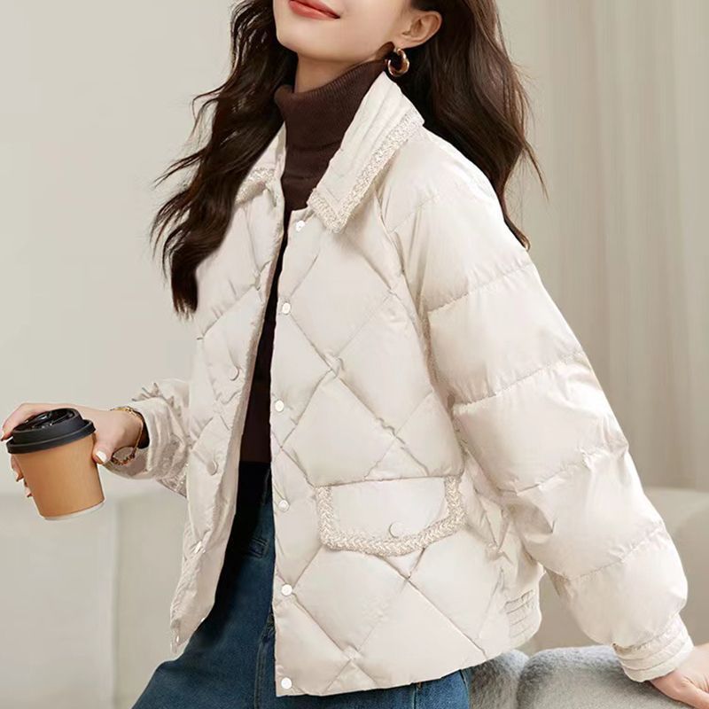 Short women's quilted jacket in a diamond design