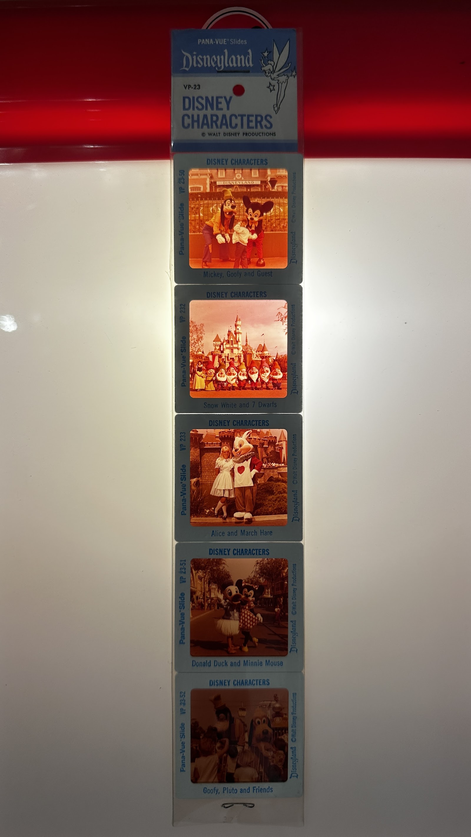 GAF Pana-Vue slide set VP-23 with five 35mm Disneyland character slides featuring Mickey Mouse, Snow White, Alice, Donald Duck, and Goofy in 1970s costumes