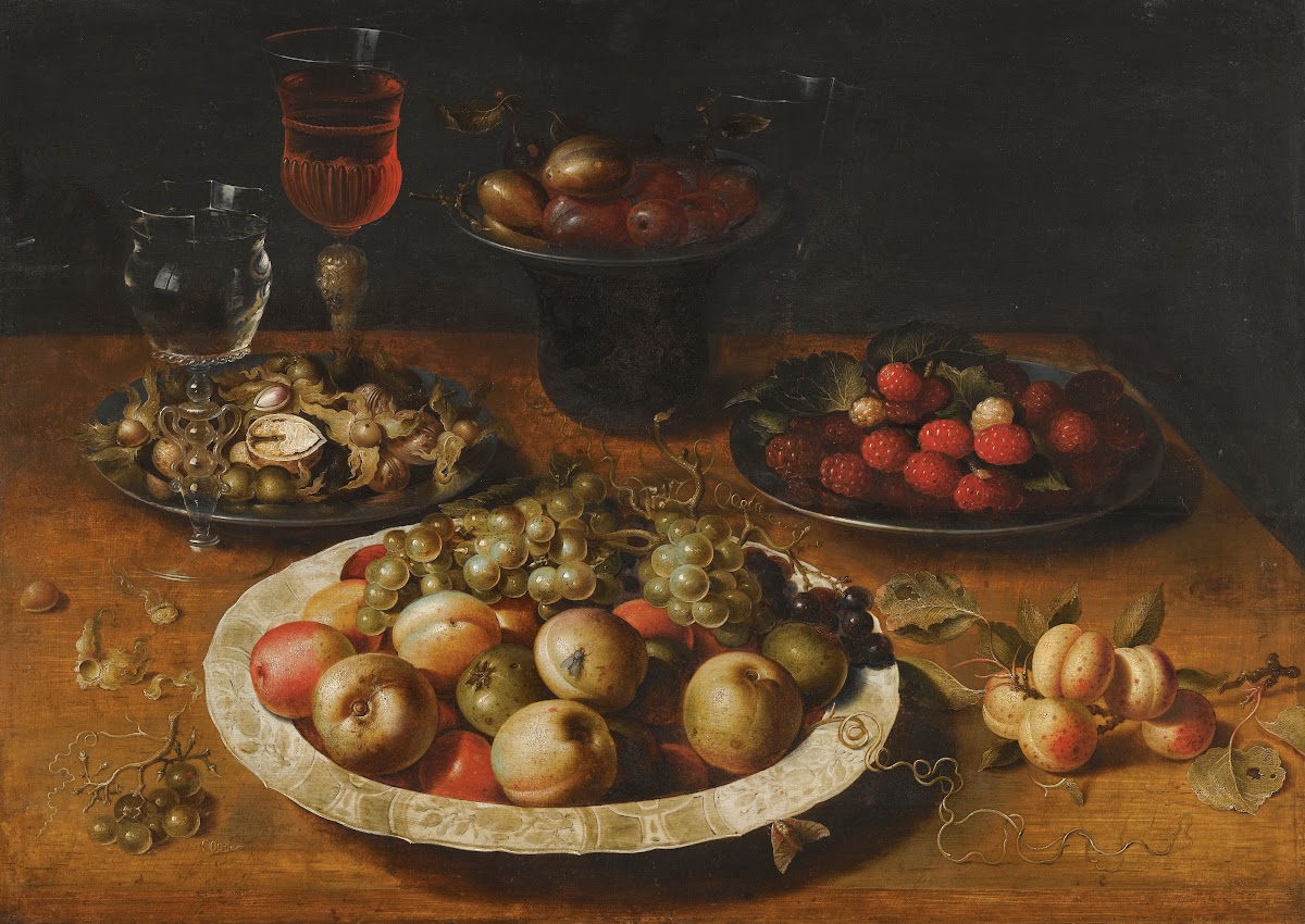 A Still Life Of Apples And Grapes In A Blue And White Porcelain Bowl