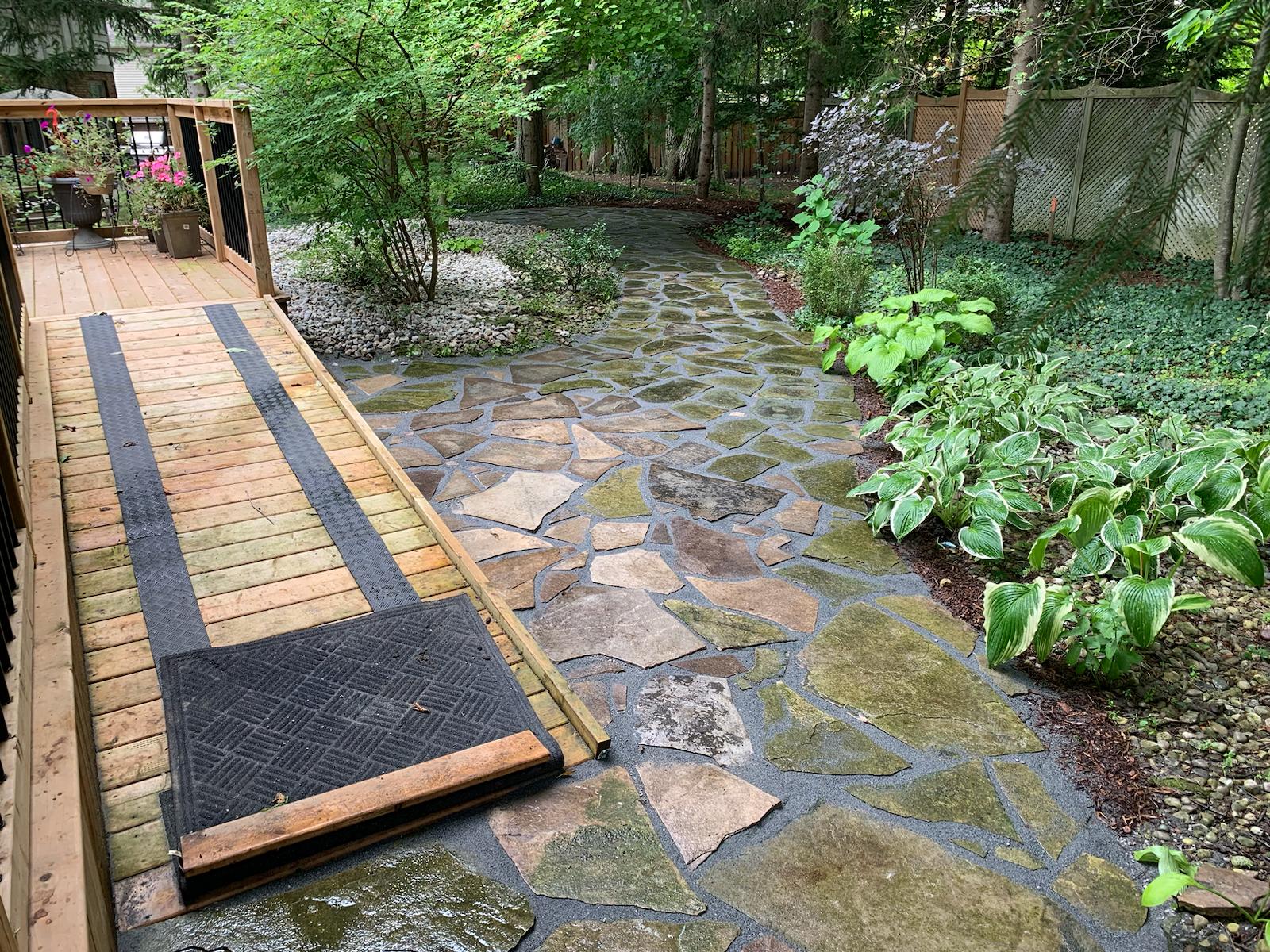 Mulched garden installation with shrubs in London, Ontario