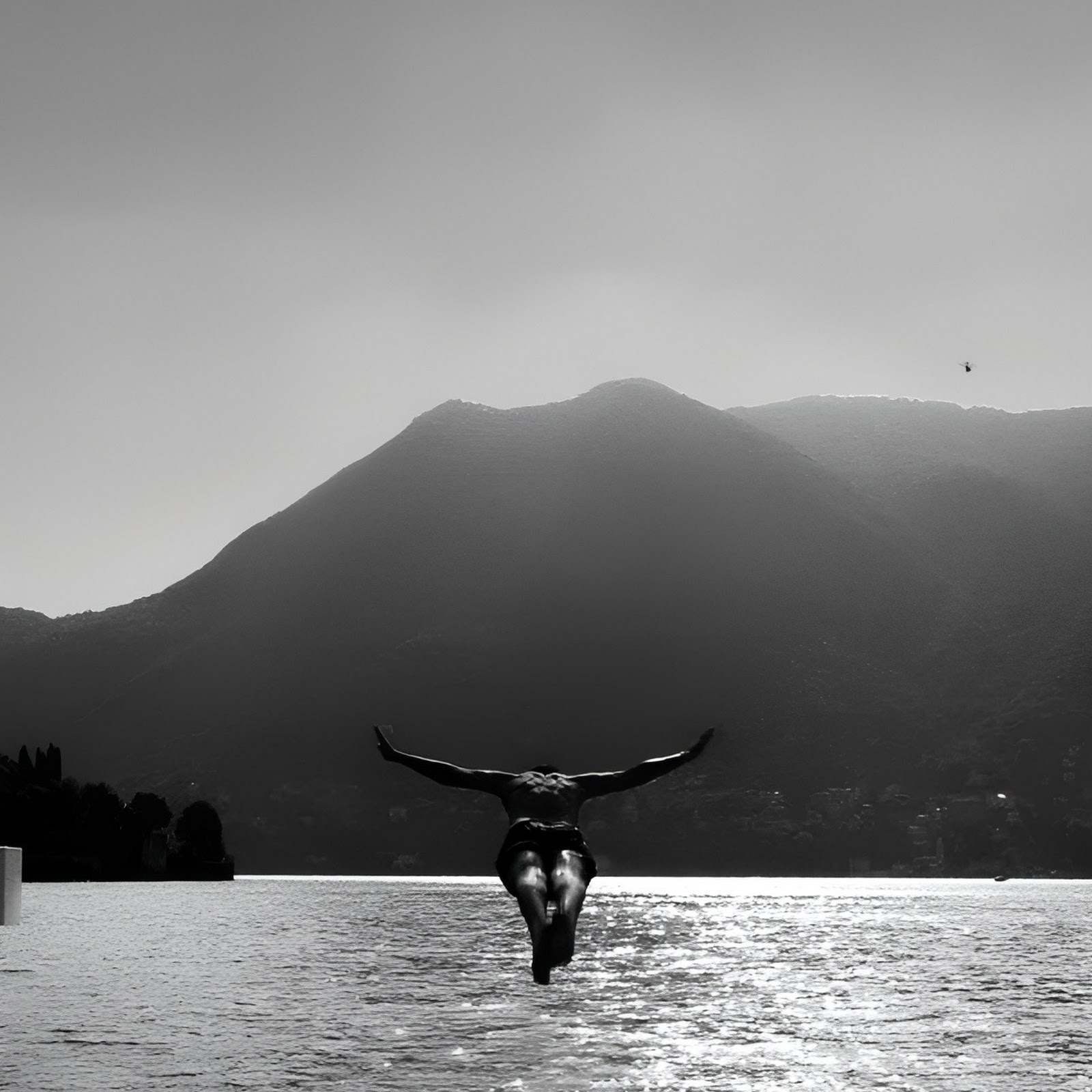 Download Man Diving From Wooden Dock Full HD iPhone