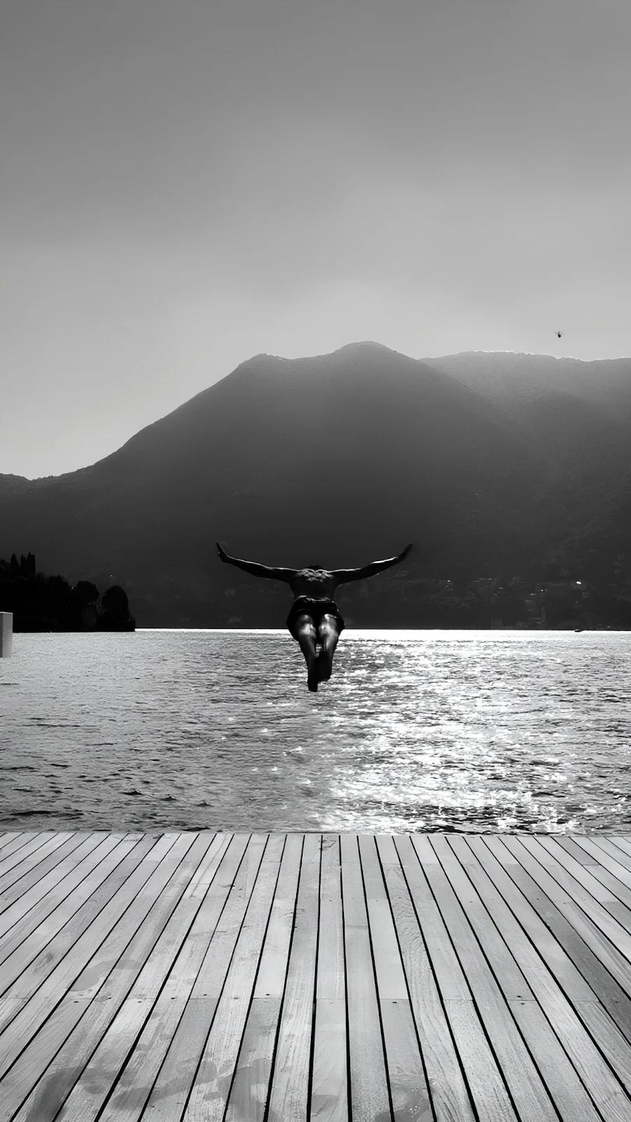 Man Diving From Wooden Dock - Monochrome Photography Full HD iPhone Wallpaper (1216x2160)