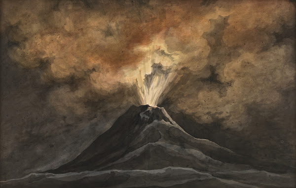 An erupting volcano by night