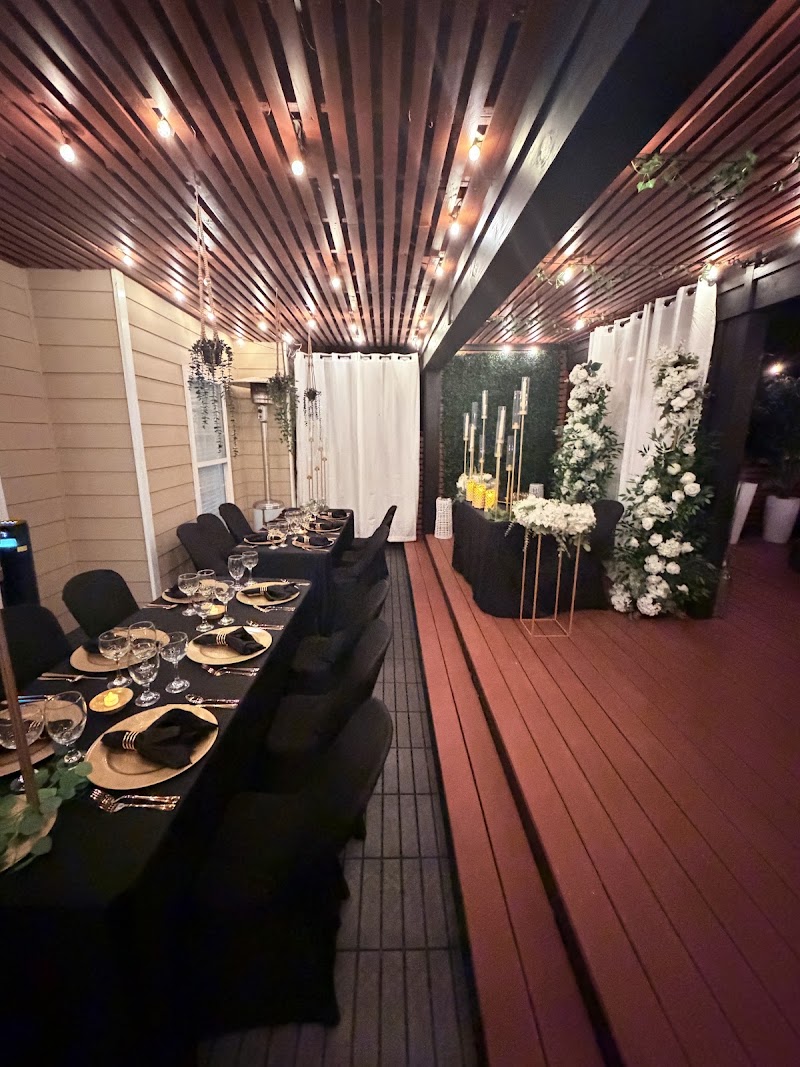 Black-tie reception table with white florals under string lights