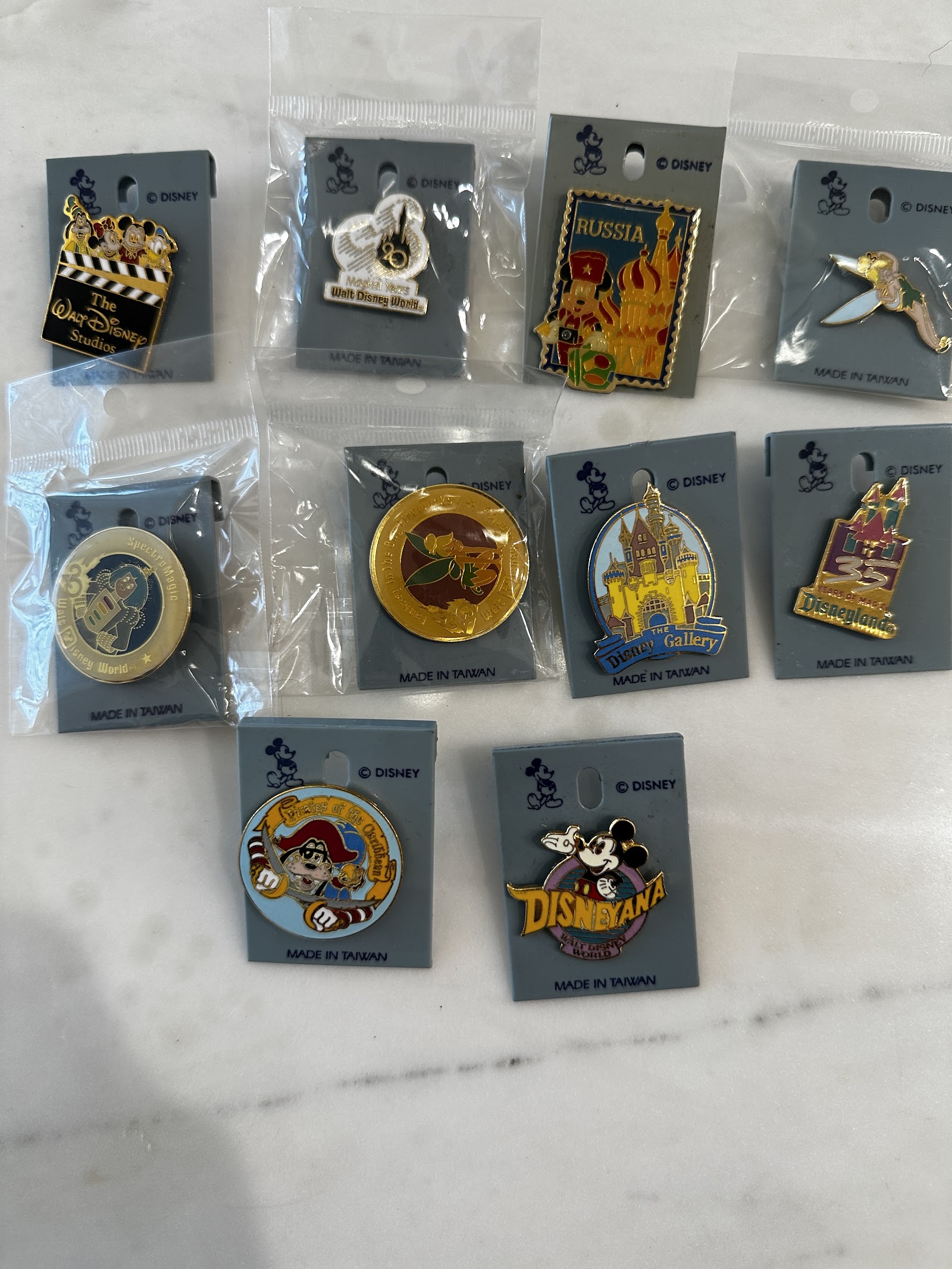 Disney enamel trading pin, approximately 1.5 inches, metal with colored enamel, showing light trading wear consistent with the early 2000s pin-trading program