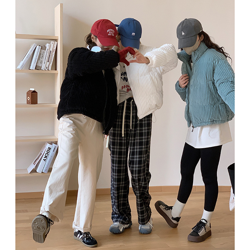 Short women's winter jacket made of corduroy with stand-up collar