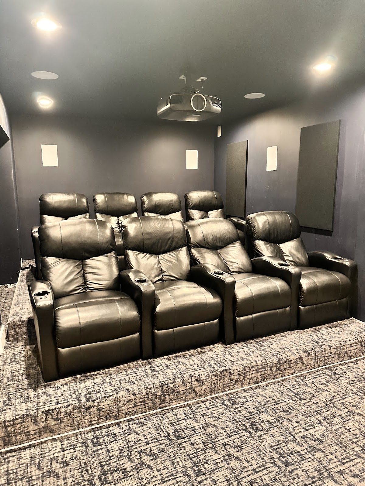 Scarsdale, NY home theater with projector and tiered seating