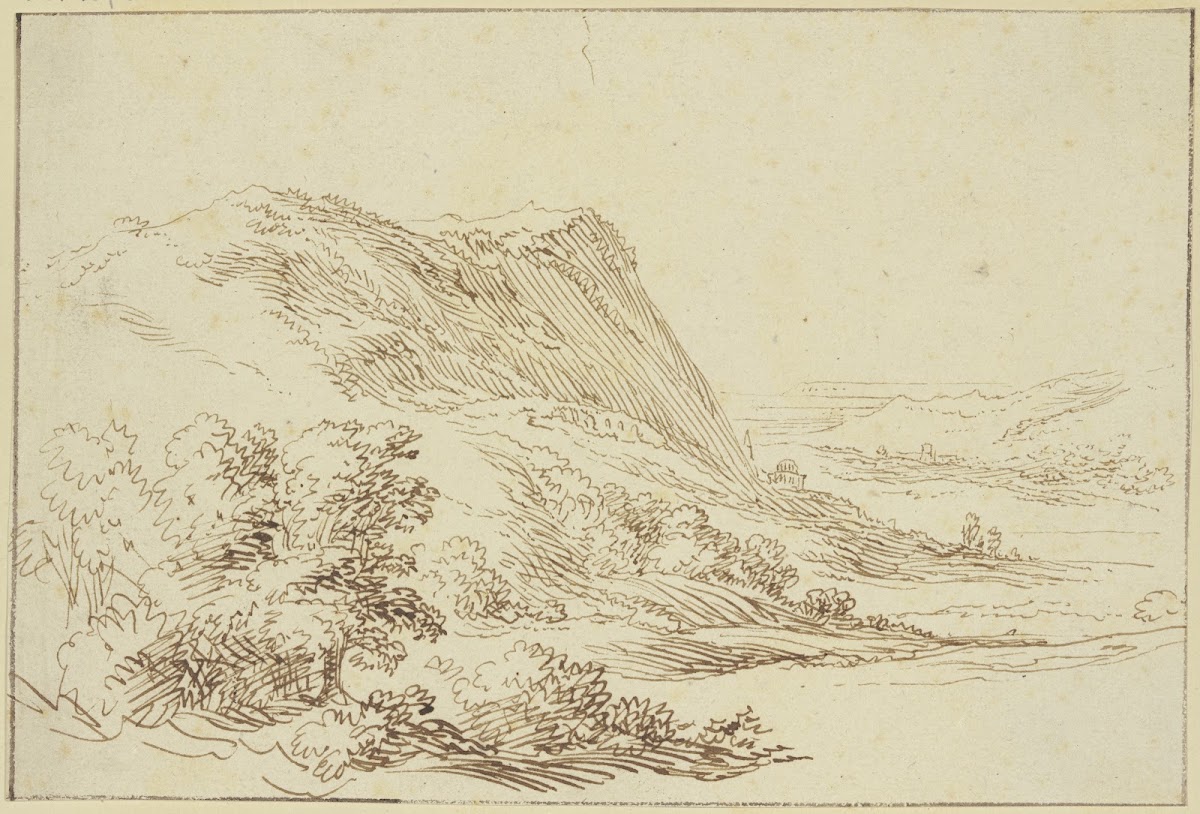 Landschaft links ein Berg und Sträucher rechts ein Tal im Hintergrund