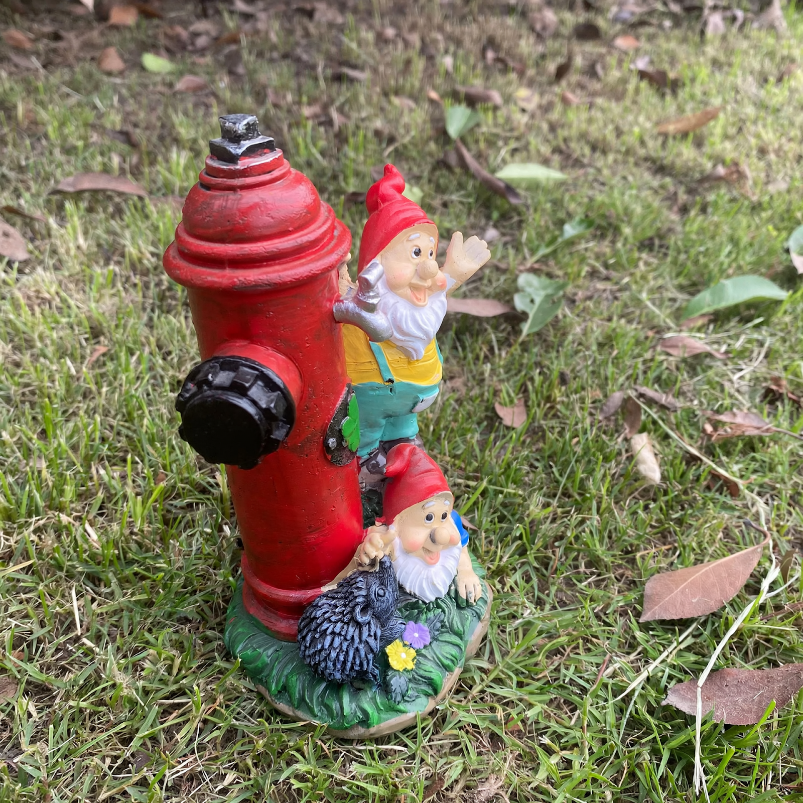 Gnome figure with red hat and fire hydrant motif