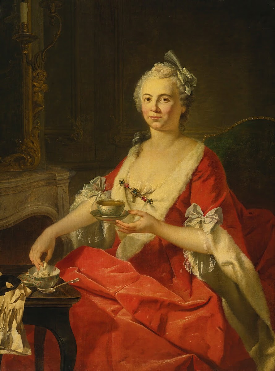 Portrait of a woman taking tea