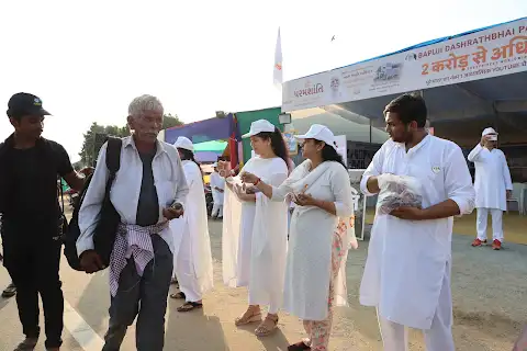 An elderly pilgrim is welcomed.