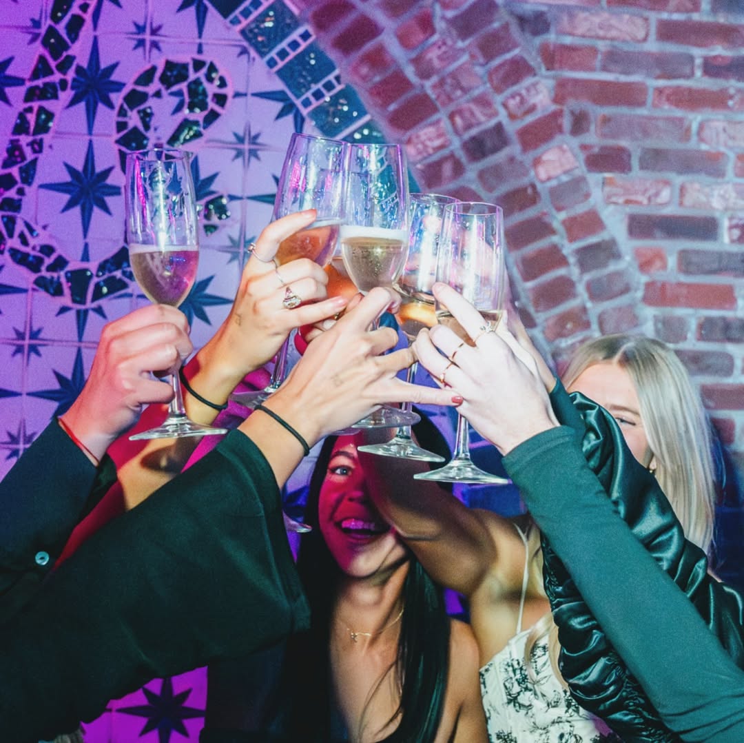 Interior shot with country-inspired furnishings and vibrant bar setup at Casa Rosa