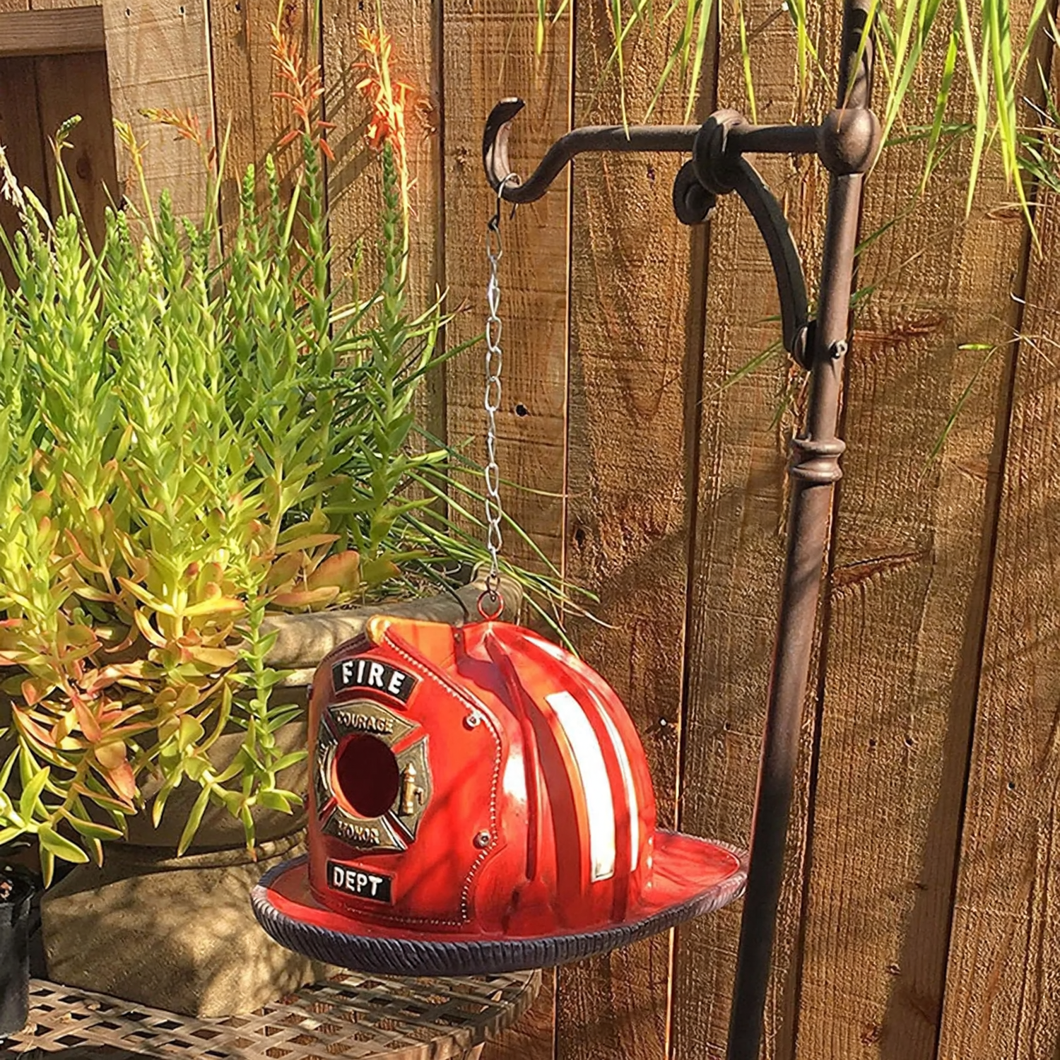 Birdhouse in fire helmet design made of resin