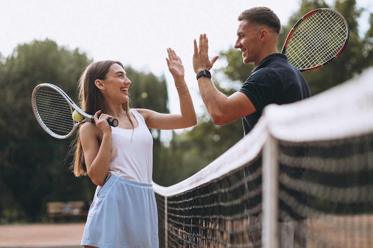 Young couple playing tennis