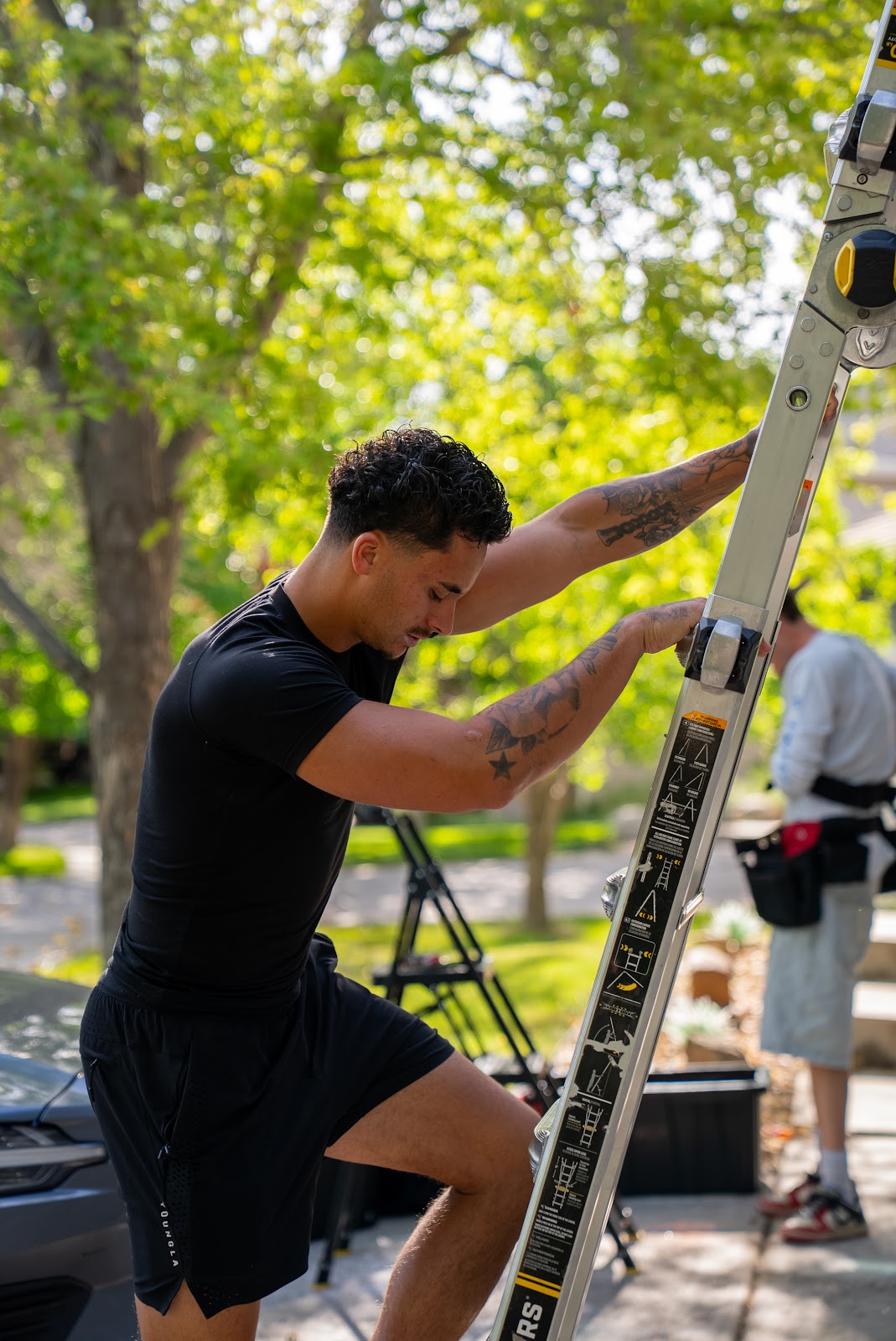 Jarod setting up ladder at residential property