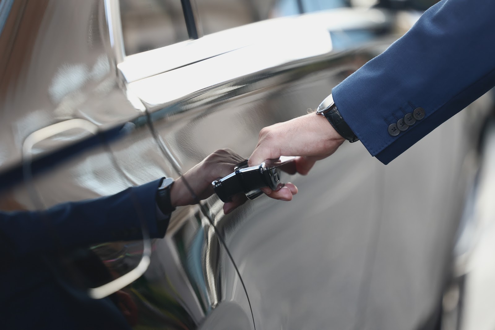 Chauffeur assisting at the vehicle door