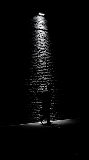 Monochrome Silhouette Against Brick Wall Spotlight - Free mobile Wallpaper