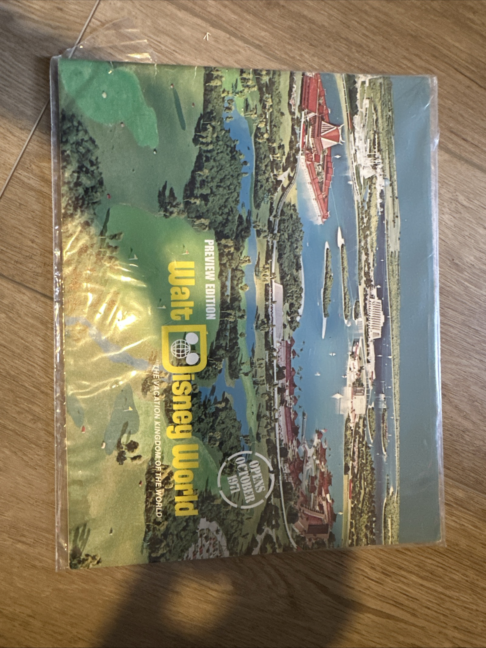1970 Walt Disney World Preview Edition oversized booklet, landscape format, featuring aerial concept painting of the Seven Seas Lagoon area and classic Disney globe logo