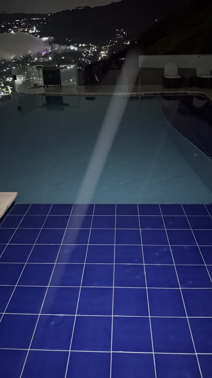 Rooftop city views — Medellín mansion party