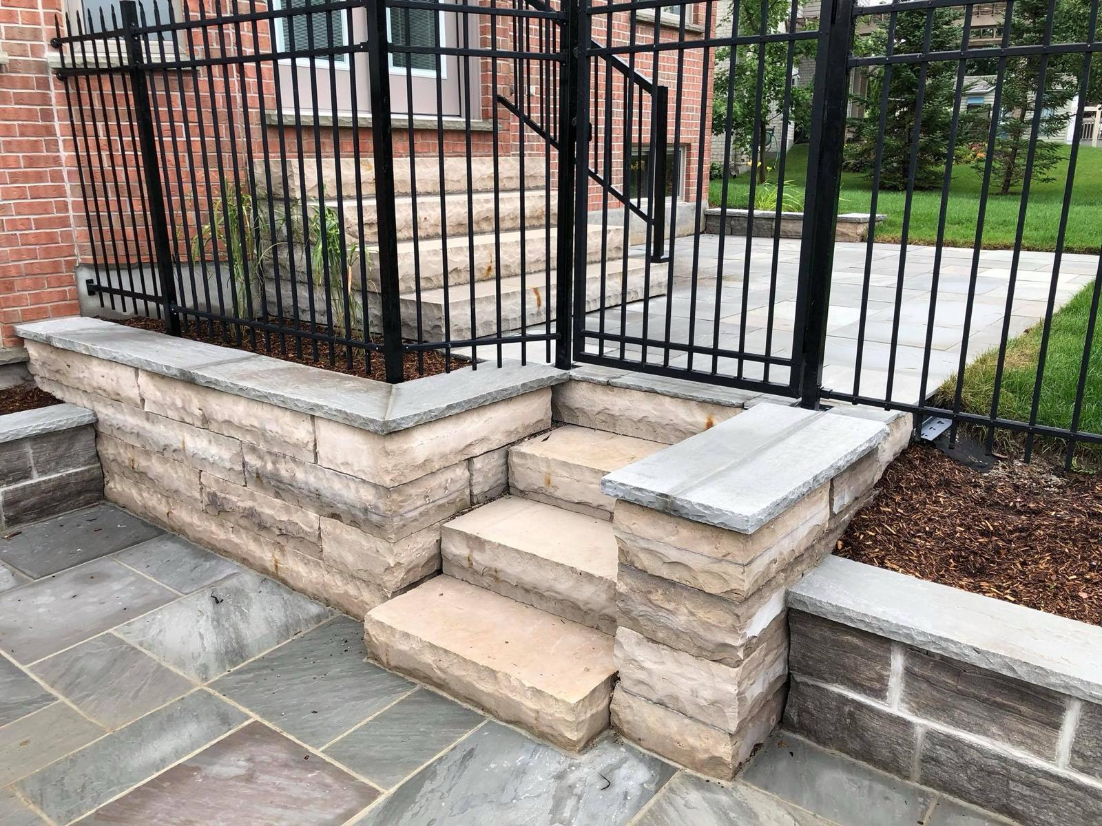 Flagstone patio with seating area in London, Ontario
