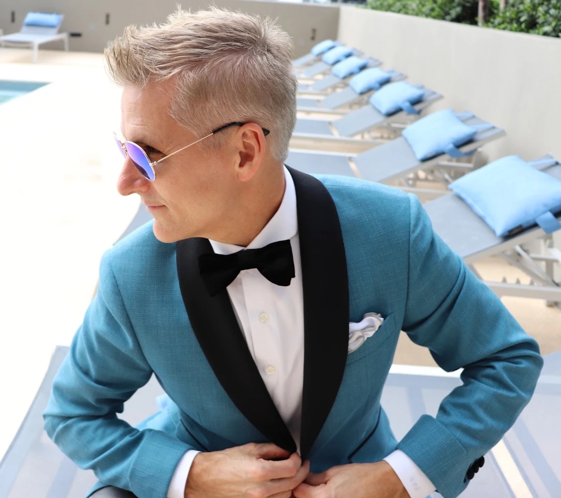 Grey tuxedo detail with satin lapel and formal accessories styled for a Miami black tie event