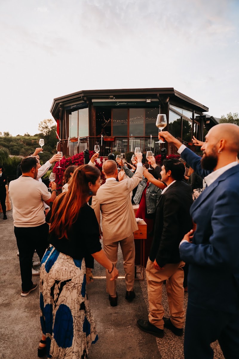 Wedding guests on the panoramic veranda at golden hour, Tenuta Sorrentino