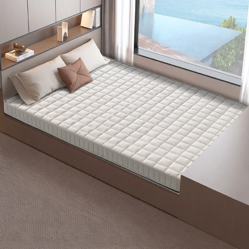 Roll mattress with spring core and memory foam