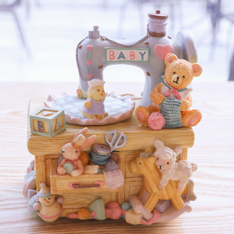 Music box in sewing machine design with bear motif