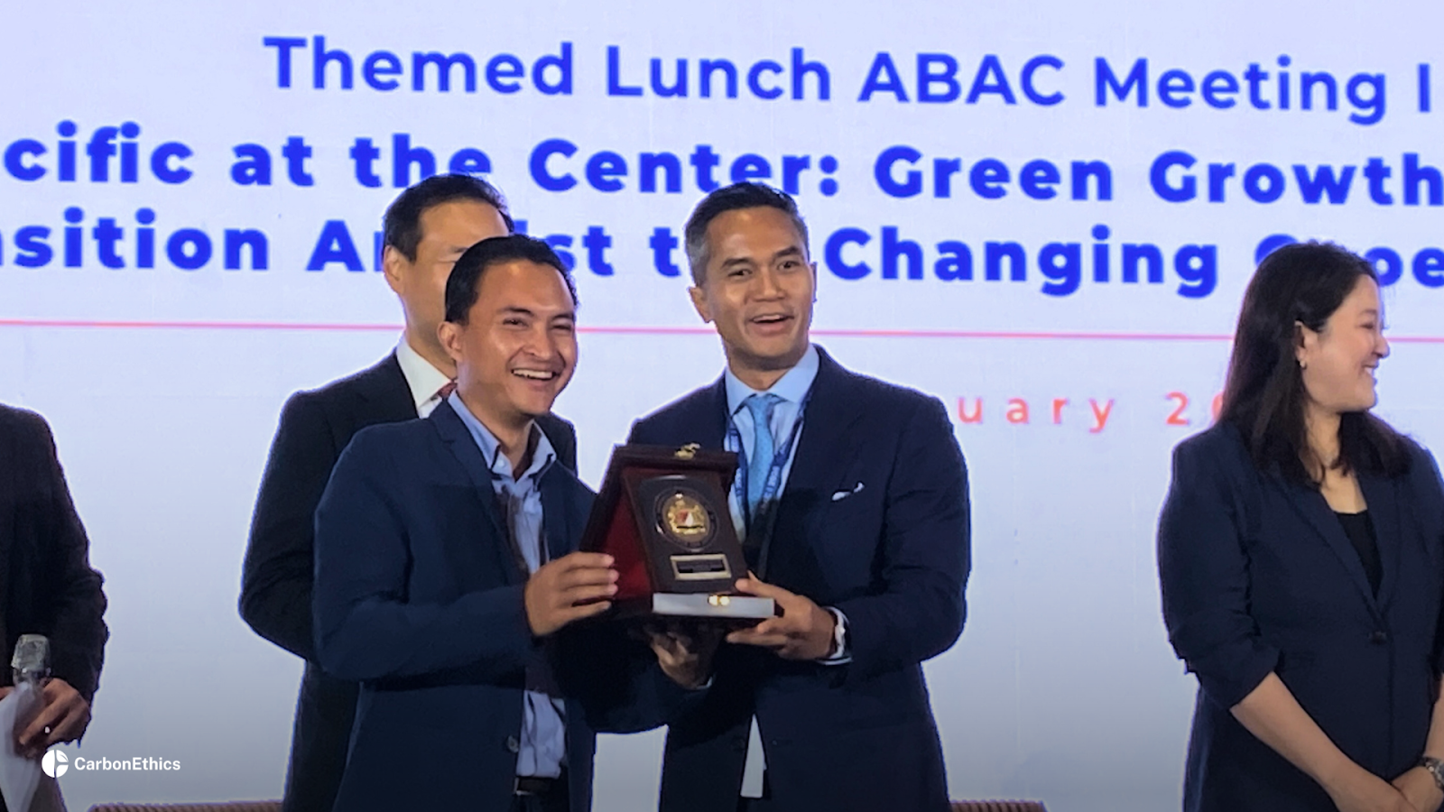 CarbonEthics CEO receiving a plaque at ABAC meeting.