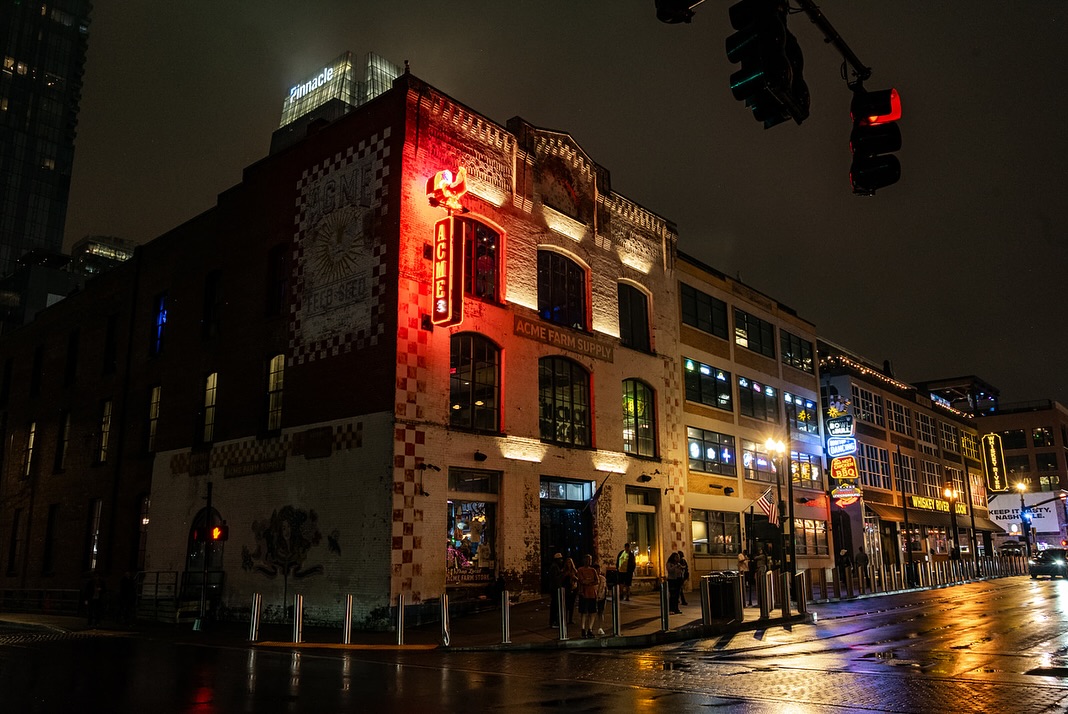 Exterior of Acme Feed & Seed on Broadway in Nashville during daytime.