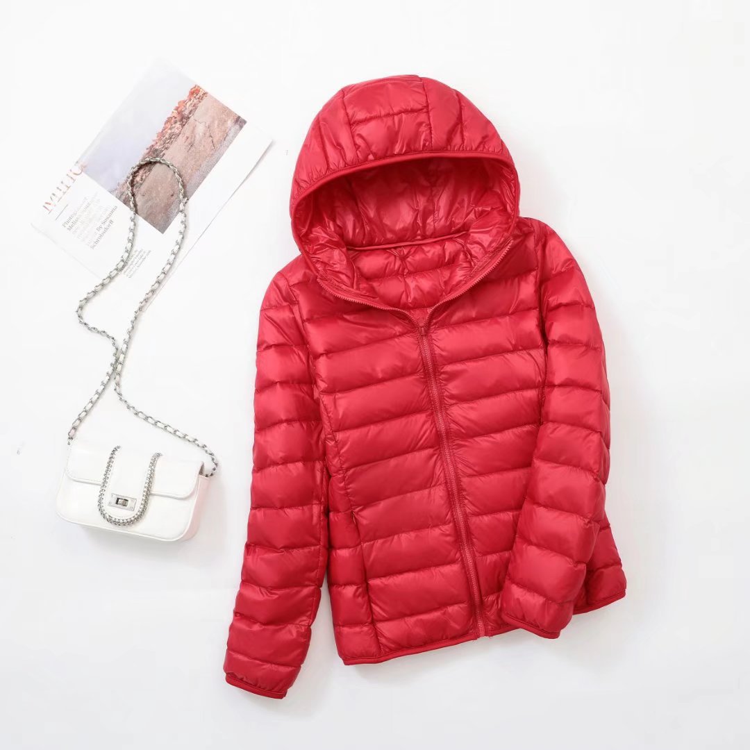 Lightweight women's down jacket with a hood, slim fit