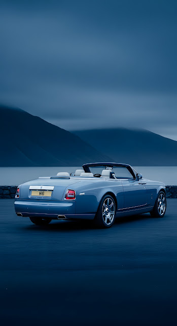 Luxury Blue Convertible Car Against Moody Mountainscape - Free mobile Wallpaper