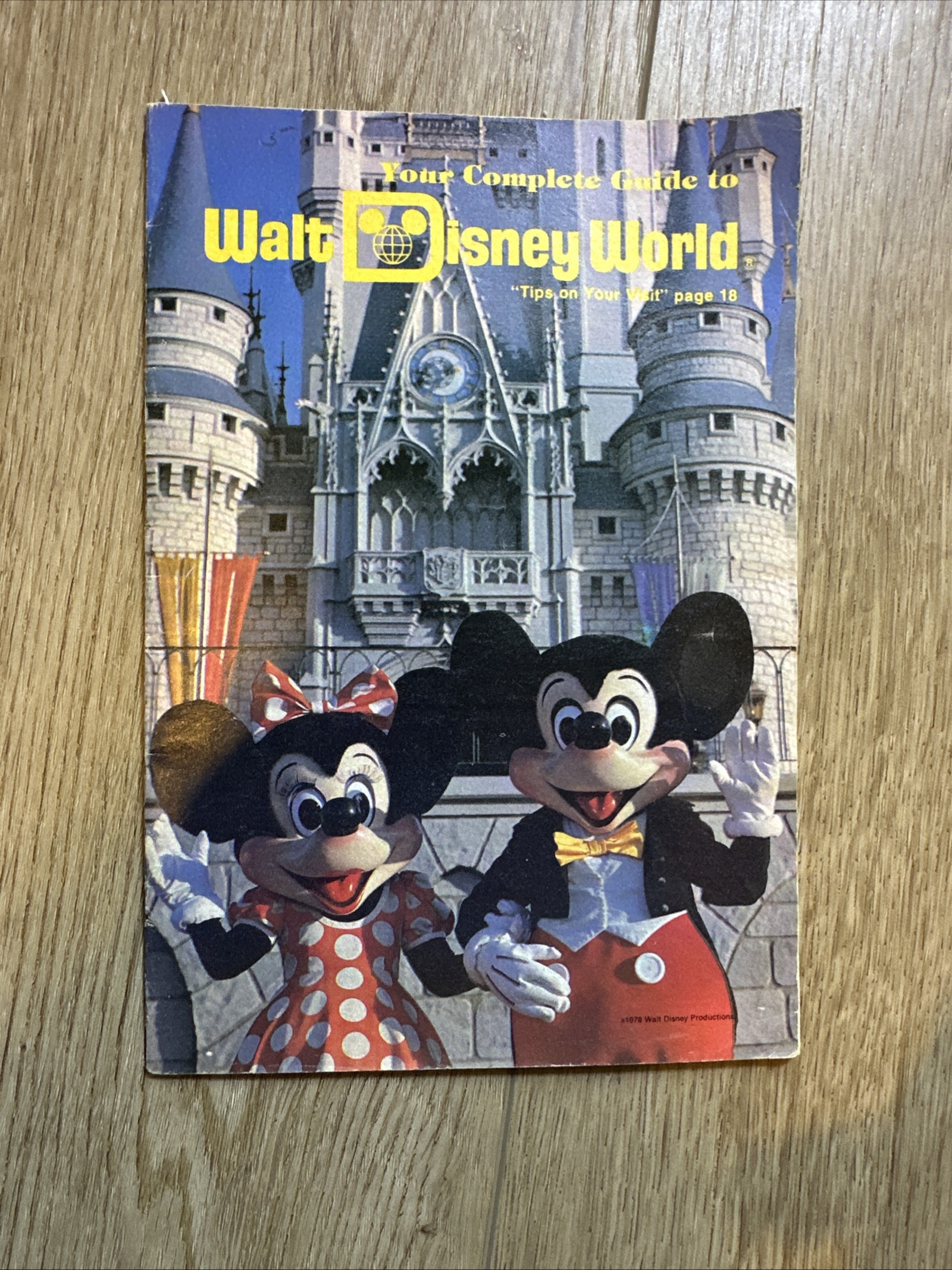 1978 Walt Disney World official pocket guide booklet featuring Mickey Mouse in tuxedo and Minnie Mouse in polka-dot dress standing before Cinderella Castle with yellow Walt Disney World logo