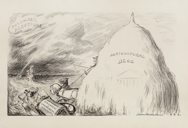 A farmer with a large stack of hay on his wagon representing the agricultural bl