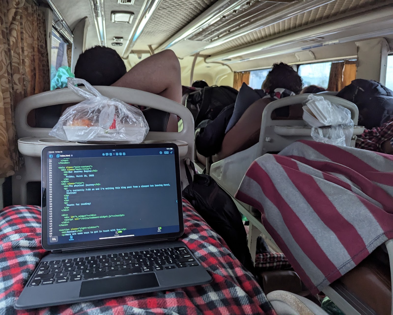 Photo of iPad in lap while on sleeper bus