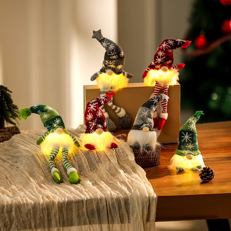 Illuminated gnome figure, sitting, with knitted hat