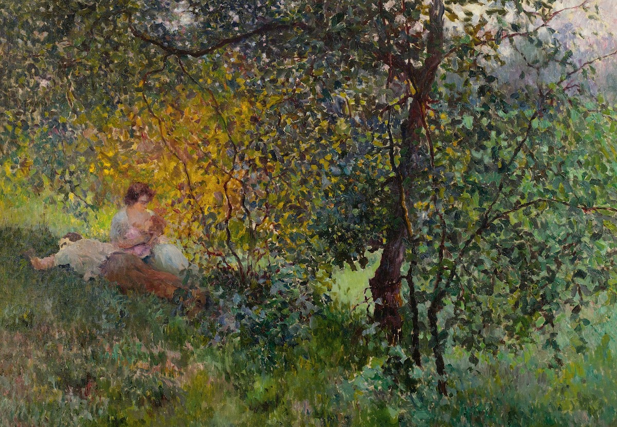 Family Resting In A Park