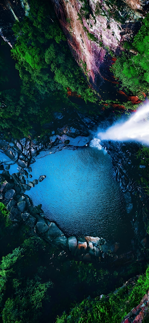 Aerial View of Jungle Waterfall Plunging into Blue Pool - Free mobile Wallpaper
