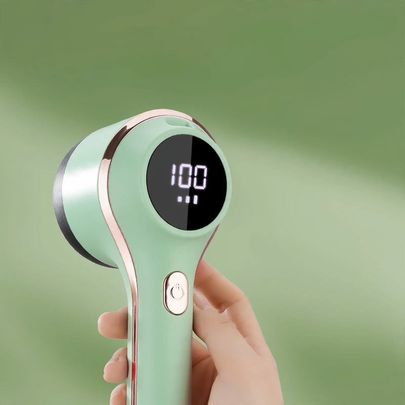 Portable battery-operated lint remover with display