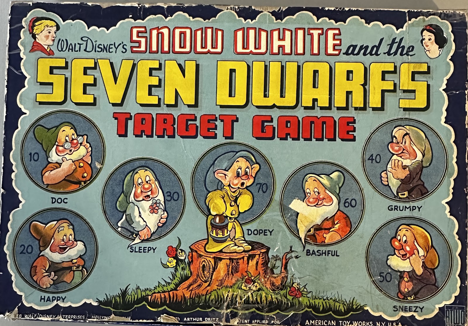 Walt Disney's Snow White and the Seven Dwarfs Target Game by American Toy Works, c.1937-1938, with the Seven Dwarfs and the Witch as point-value targets and a Walt Disney Enterprises copyright