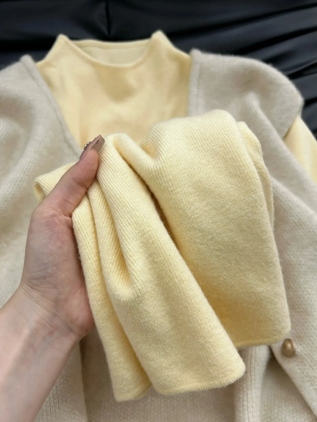 Women's knitted sweater with a small stand-up collar