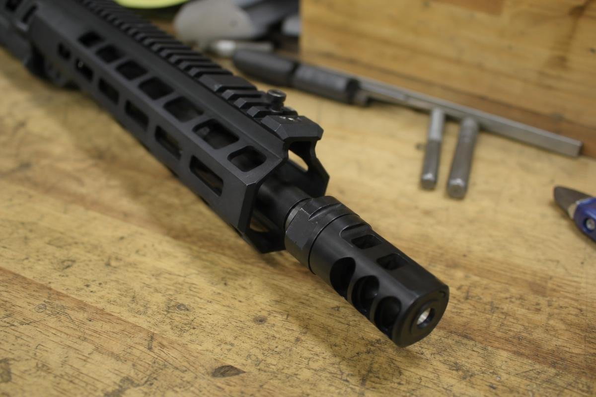 what is a linear compensator shown mounted on an AR-15 barrel