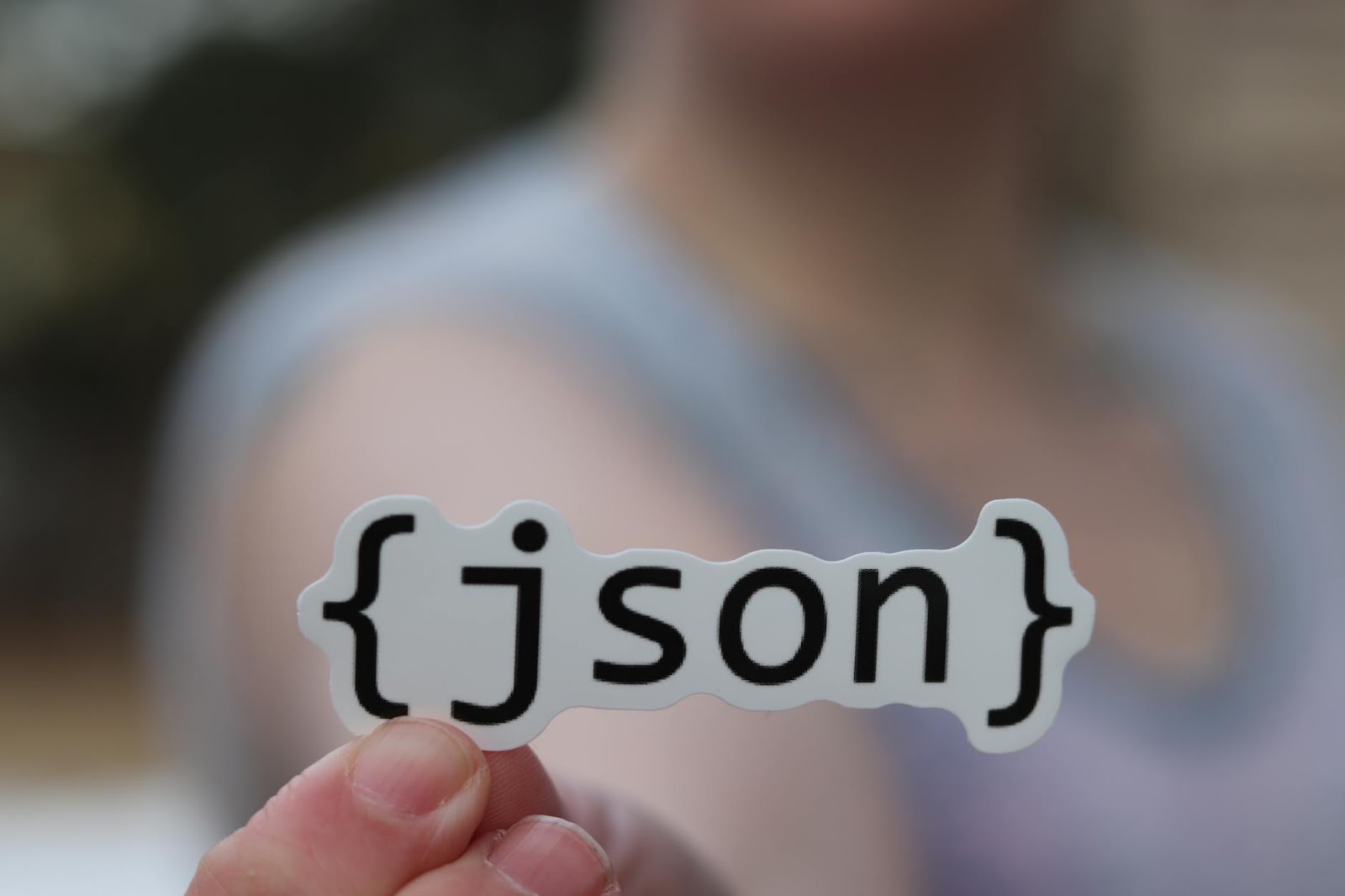 Hands meticulously assembling a glowing digital structure, symbolizing the careful construction and future of Web3 development trends.