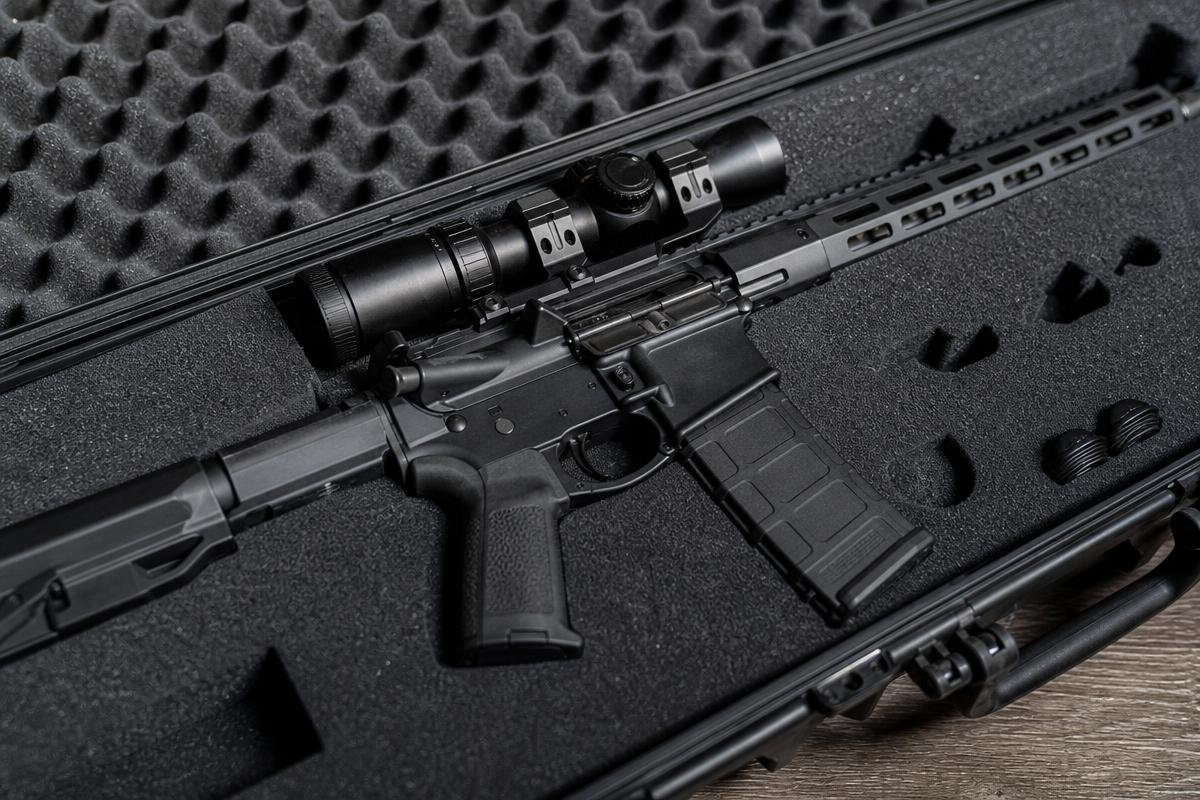 gun case for transport with scoped AR-15 secured in foam