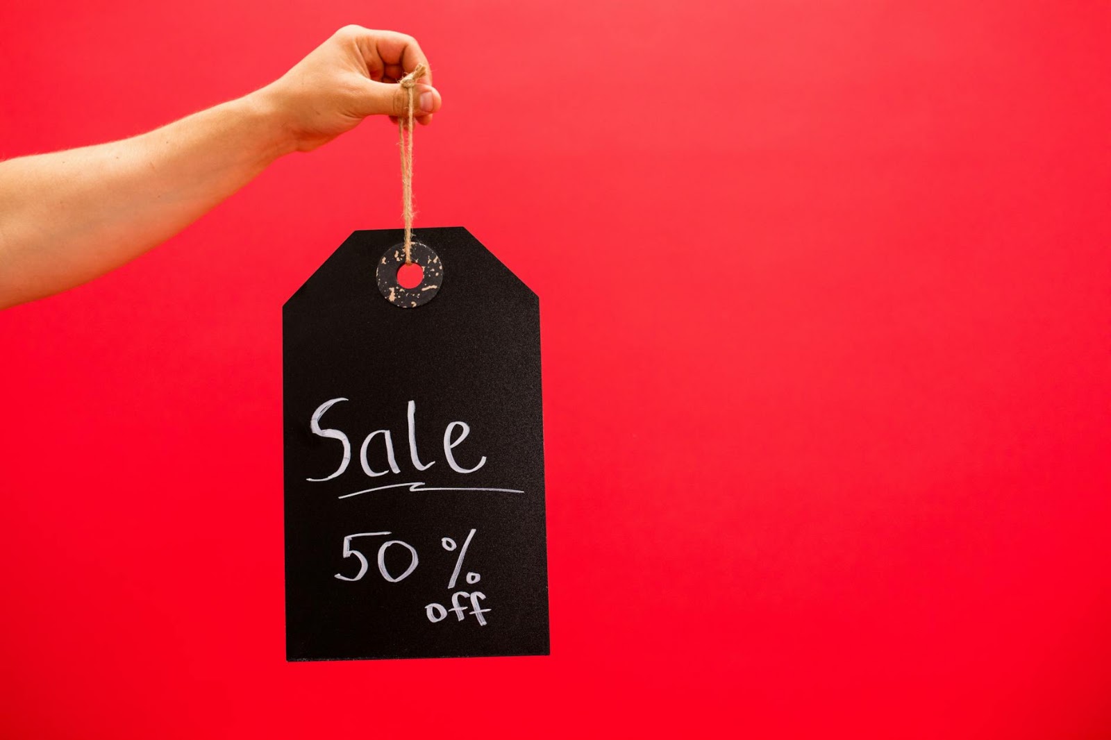 A thoughtful shopper analyzing various online offers and live social shopping prices, reflecting on the psychology of consumer behavior and the Live Social Shopping Price Surge.