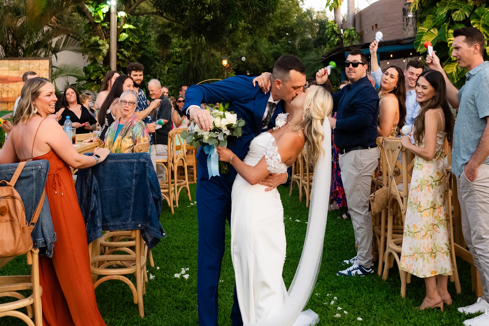 Puerto Vallarta wedding photographer capturing romantic beach ceremony at sunset with Canadian couple kissing on golden sand beach destination wedding photography Mexico