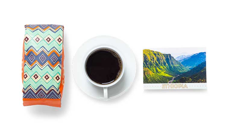Atlas Coffee Club monthly gift box with tasting card and freshly roasted coffee bag